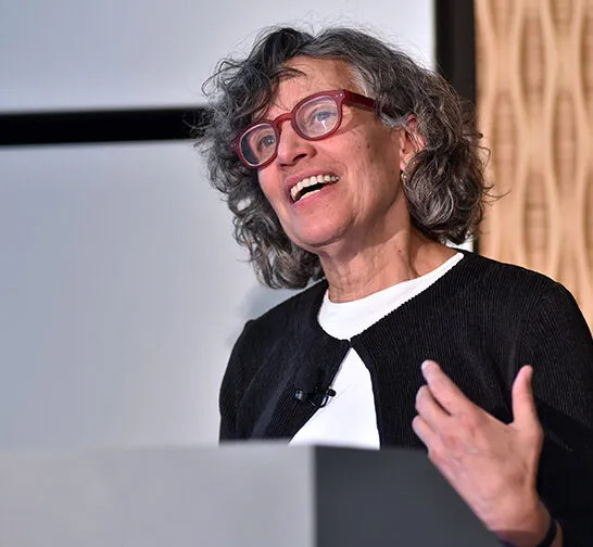 Dr. Bassett speaking at a podium