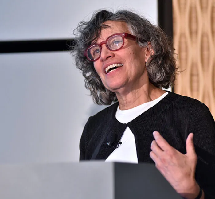 Dr. Bassett speaking at a podium